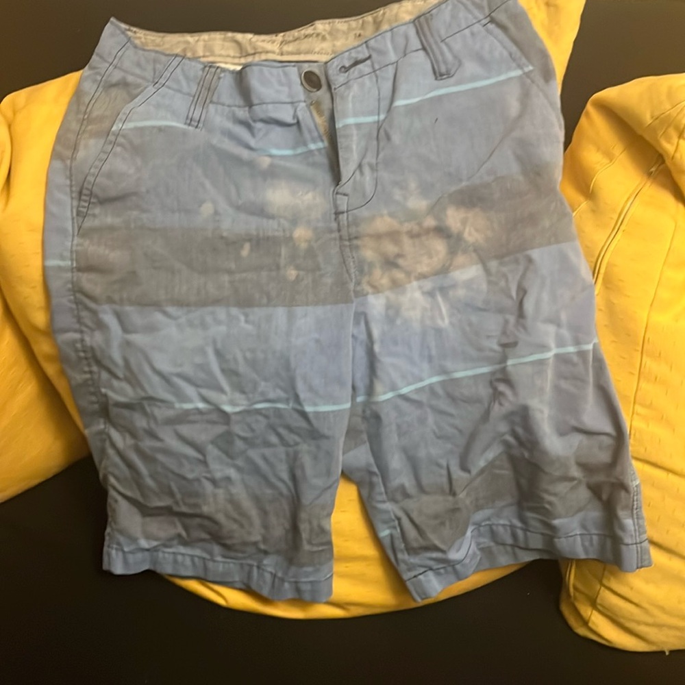 Shorts with bleach stains.